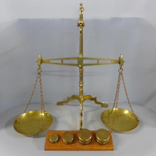 815 - A set of brass banker's scales and weights