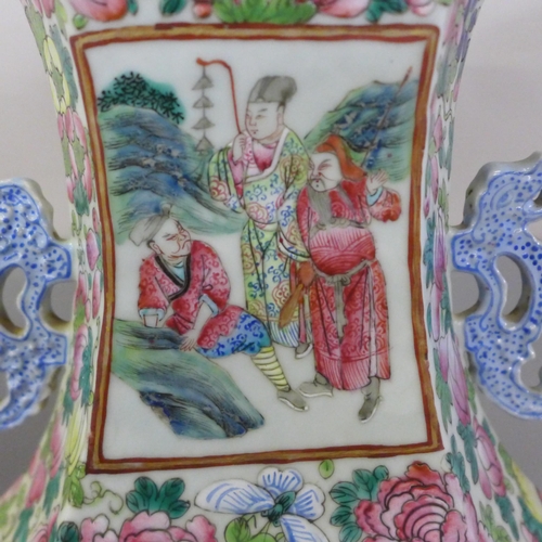 817 - A 19th Century Canton famille rose vase, crack to one panel, 59cm