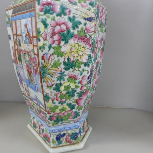 817 - A 19th Century Canton famille rose vase, crack to one panel, 59cm