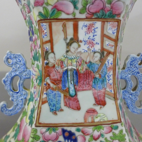 817 - A 19th Century Canton famille rose vase, crack to one panel, 59cm