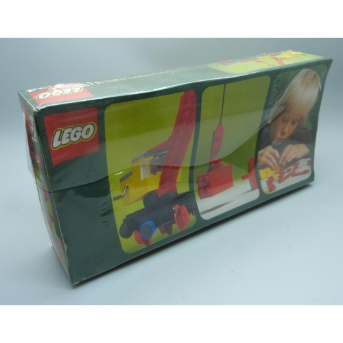 829 - Four early 1970s Lego kits, 312, 311, 130 and 134, still in original shrink wrap but with some split... 