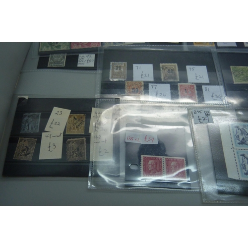 836 - World stamps on eighteen stock cards, (all identified and catalogued at over £2,000)