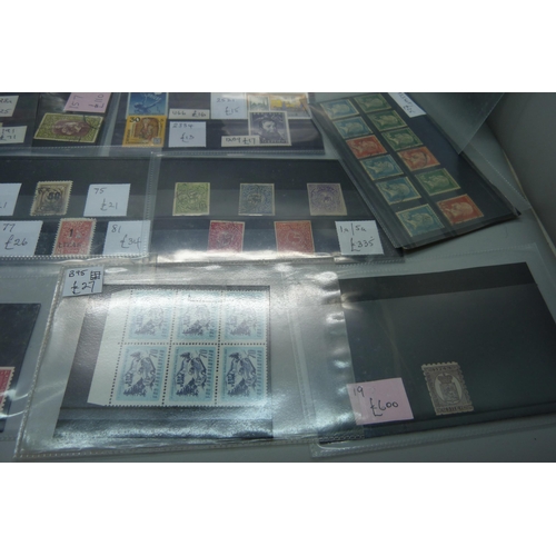 836 - World stamps on eighteen stock cards, (all identified and catalogued at over £2,000)