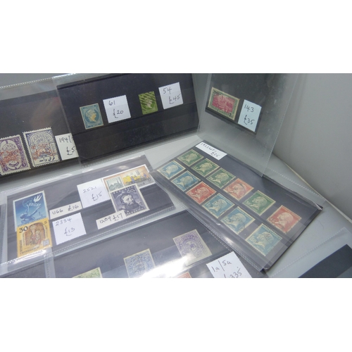 836 - World stamps on eighteen stock cards, (all identified and catalogued at over £2,000)