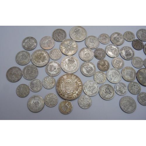 853 - A collection of 1920-1946 half silver coins, together with a silver 1887 half crown, total weight ap... 