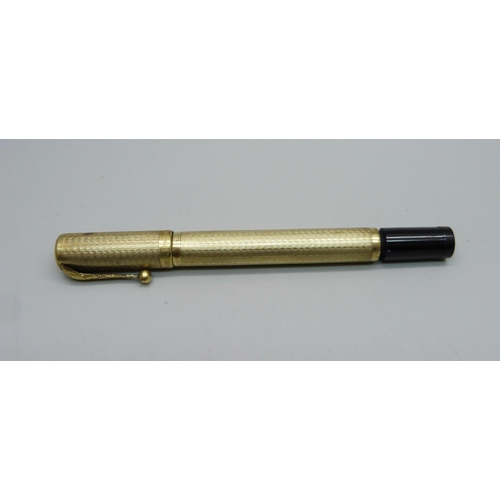 885 - An 18ct rolled gold safety pen by Columbus, circa 1930s, the cap and barrel with engraved decoration... 