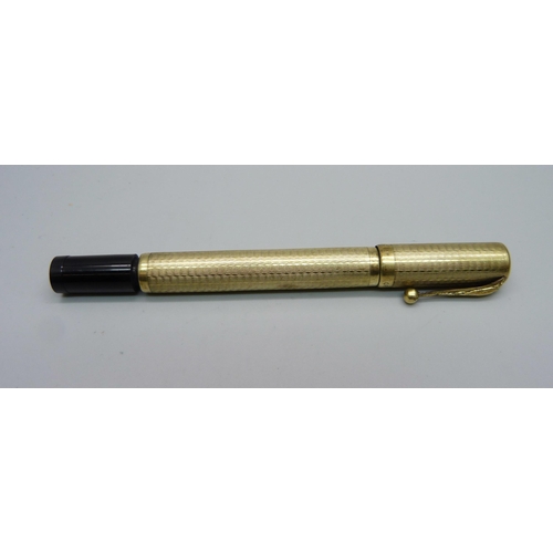 885 - An 18ct rolled gold safety pen by Columbus, circa 1930s, the cap and barrel with engraved decoration... 