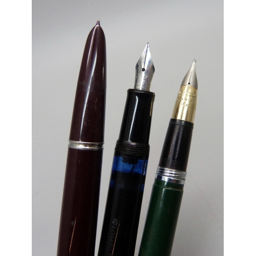 886 - A Sheaffer jade green snorkel fountain pen with a 14ct gold nib (cap a/f)), a Parker fountain pen an... 