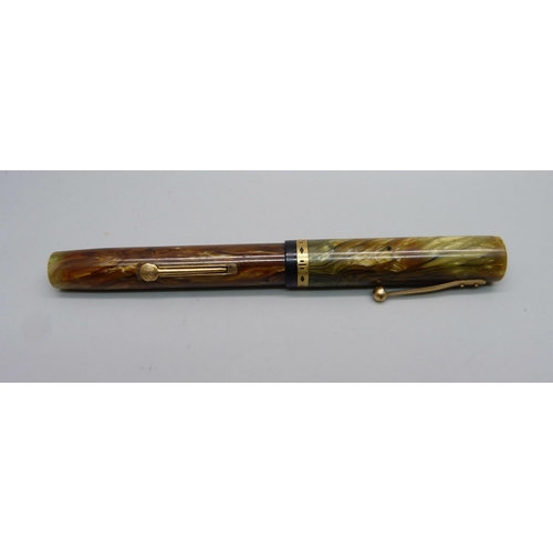 888 - A Waterman's Ideal flat top fountain pen with brown ripple barrel and green ripple cap