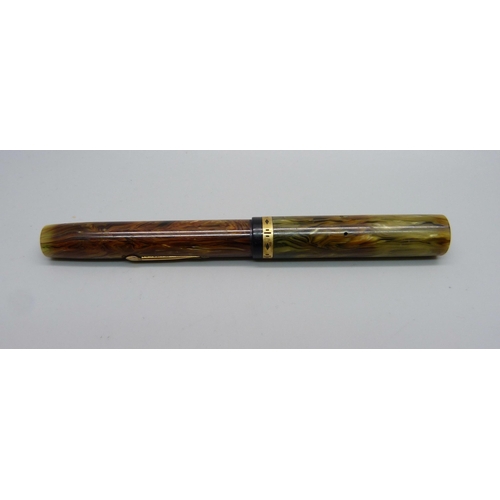 888 - A Waterman's Ideal flat top fountain pen with brown ripple barrel and green ripple cap