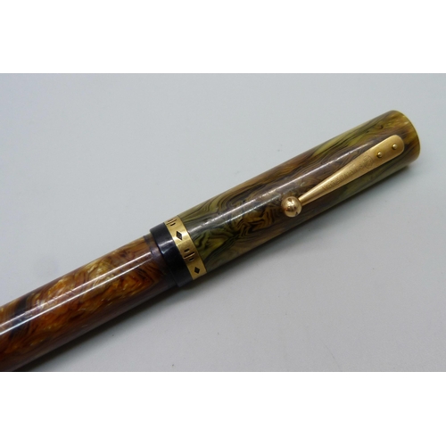 888 - A Waterman's Ideal flat top fountain pen with brown ripple barrel and green ripple cap