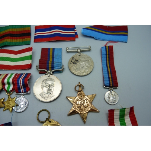 891 - A Zimbabwe Independence medal, other medals and ribbons