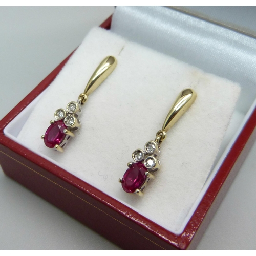 962 - A pair of 9ct gold ruby and diamond drop earrings, boxed, 2.1g