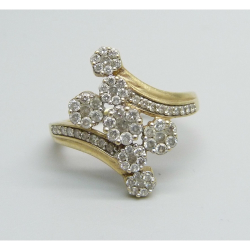 966 - A 9ct gold and diamond encrusted ring with seven diamond clusters, 4.2g, U