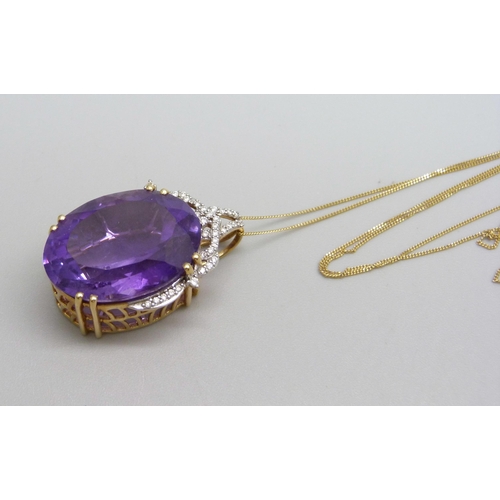 976 - An 18ct gold diamond and amethyst pendant on a fine 18ct gold chain, 9.6g, chain 44cm