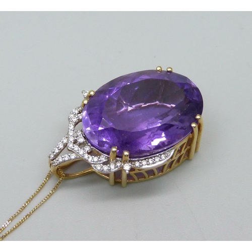 976 - An 18ct gold diamond and amethyst pendant on a fine 18ct gold chain, 9.6g, chain 44cm