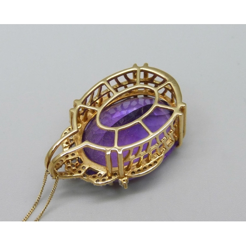 976 - An 18ct gold diamond and amethyst pendant on a fine 18ct gold chain, 9.6g, chain 44cm