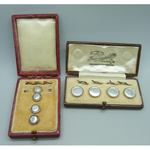 994 - A cased set of four 9ct gold and pearl buttons, 4.7g, and a set of three buttons