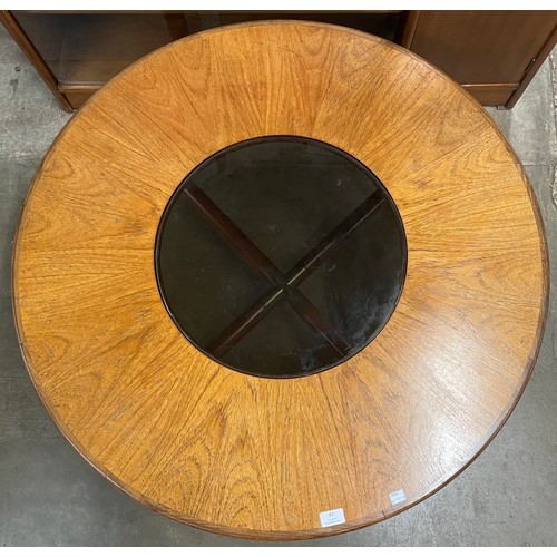 82 - A G-Plan teak and glass topped circular coffee table