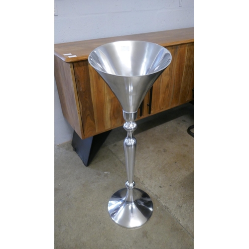 1310 - A chrome floor standing champagne stand