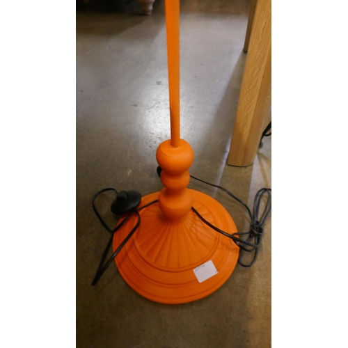 1347 - An orange floor standing lamp in the form of a parrot