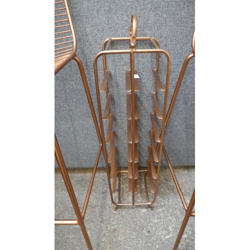 1420 - A pair of copper coloured bar stools and a wine rack