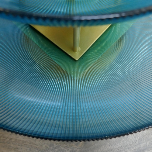 1424 - A set of three blue glass bowls on gold stands