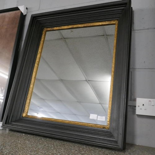 1428 - A black and gold square wall mirror