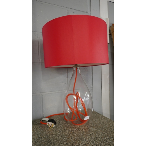 1482 - A glass table lamp with red shade