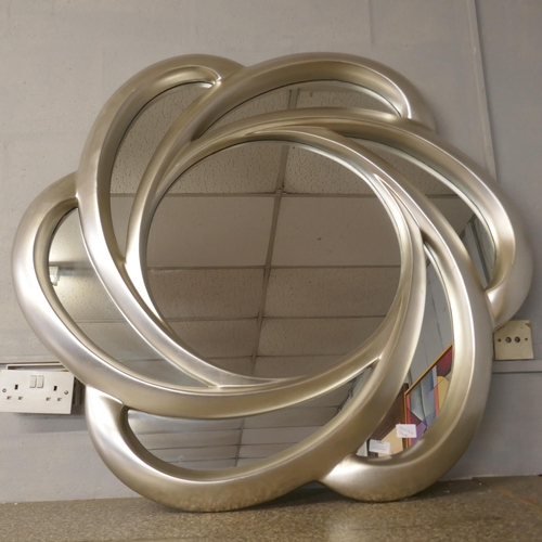 1487 - A swirl framed wall mirror