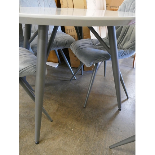 1489 - A Logan circular dining table and four Aran grey velvet chairs