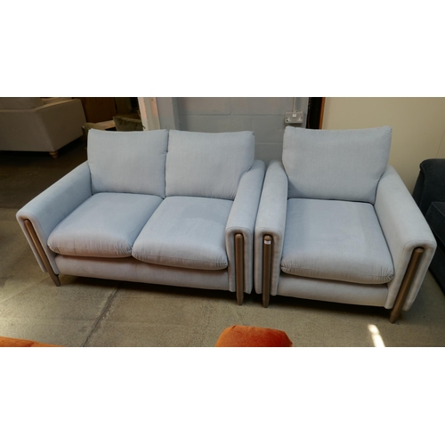 1499 - A sky blue upholstered two seater sofa and armchair on a semi exposed frame RRP £2314