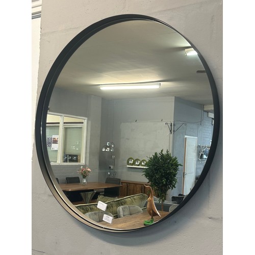 1349 - A circular wall mirror