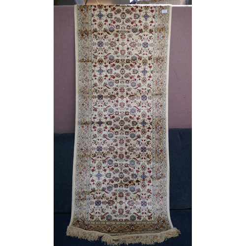 1503 - An ivory ground full pile cashmere runner, all over floral pattern, 240 x 70cm