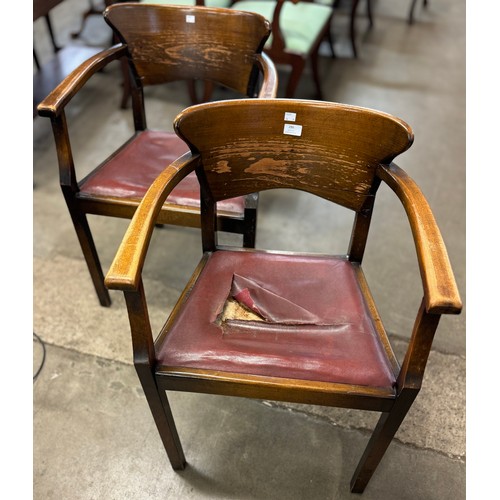 240 - A pair of early 20th Century oak desk chairs