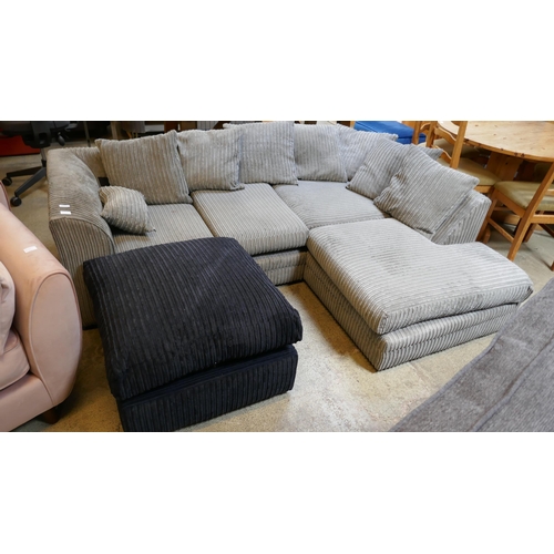 1544 - A grey cord corner sofa and a black footstool