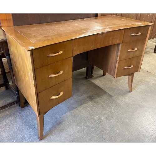 81A - A walnut concave desk