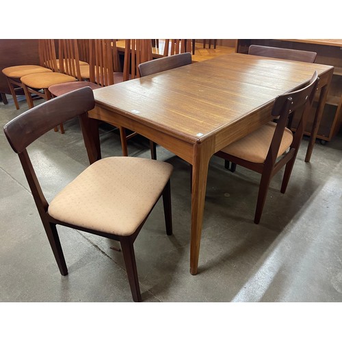 85 - A Younger Fonseca teak extending dining table and four chairs, designed by John Herbert