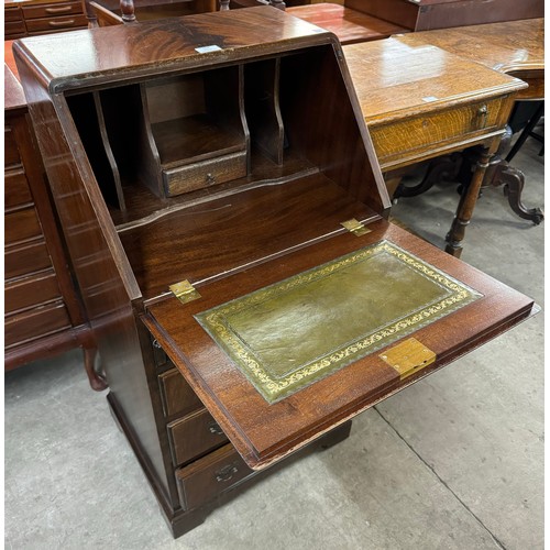 154 - A small George III style flame figured mahogany bureau