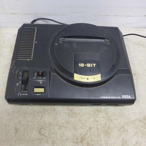 2094 - A Sega Mega Drive games console with two wired controllers, power supply and video cable and 13 game... 