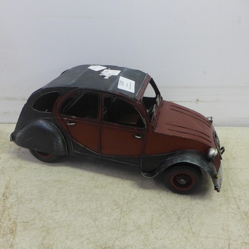 2103 - A tin plate model of a Citroen 2CV