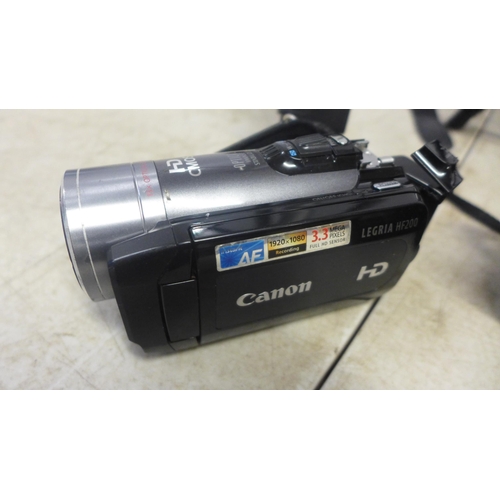 2119 - A Fuji Film Finepix S 14 Mega Pixel digital camera, a Canon Legria HF200 HD CMOS digital cam-corder ... 