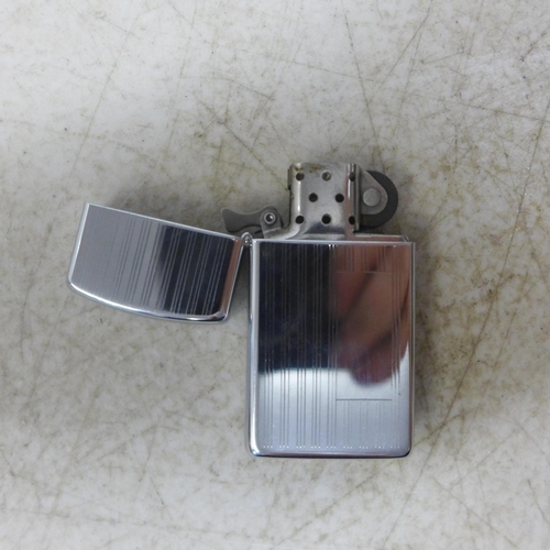 2125 - A Model 1615 slim Zippo lighter and a Hadson Zippo style lighter