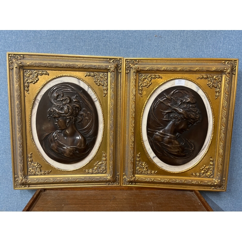 313 - A pair of 19th Century style bronze effect oval plaques, portrait of lady's, gilt frames