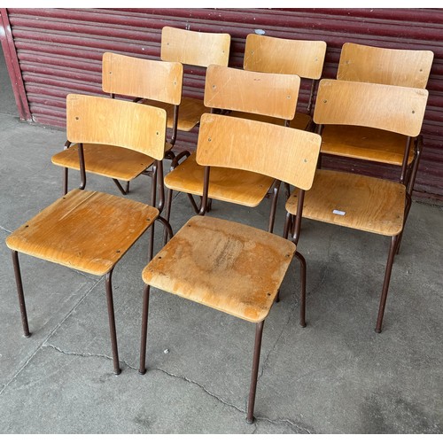 255 - A set of plywood and tubular metal stacking chairs and three others