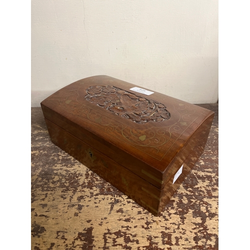 329 - An eastern inlaid hardwood jewellery box