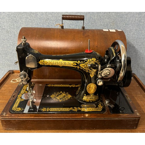 297 - A cased Singer sewing machine