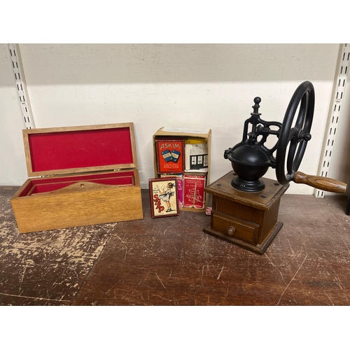 330 - A coffee grinder, a box of vintage playing cards and an oak jewellery casket