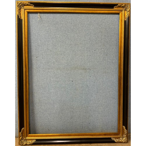 298A - A large ebonised and parcel gilt picture frame