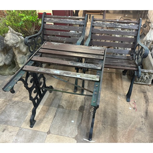 270 - A wrought iron framed garden table and two chairs